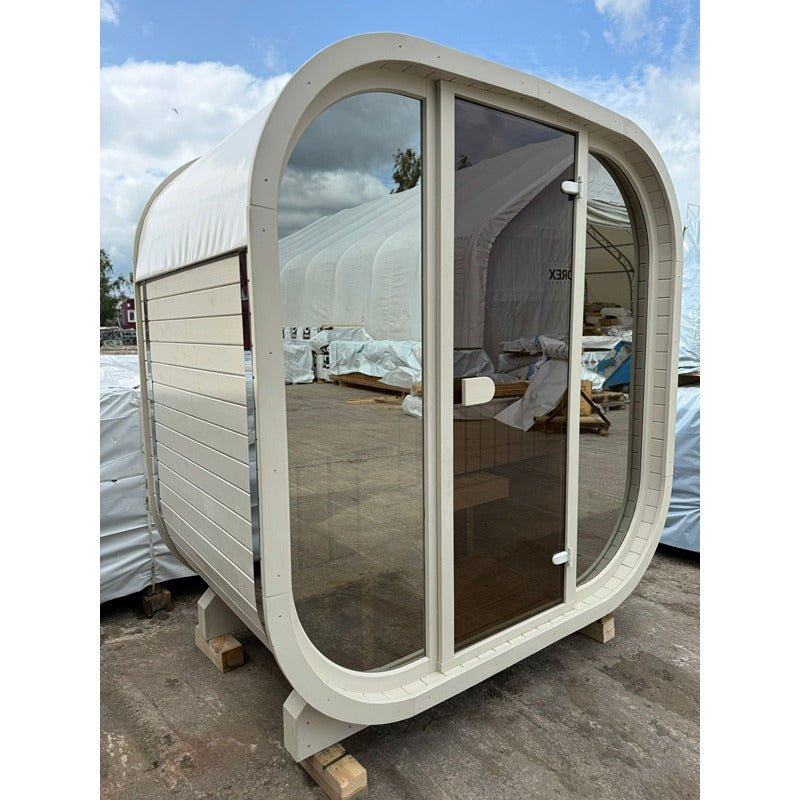 Celsium Ula Mini sauna in beige with all-glass front during the Installation - compact design sauna for two Persons with a light wood look and gently rounded shape